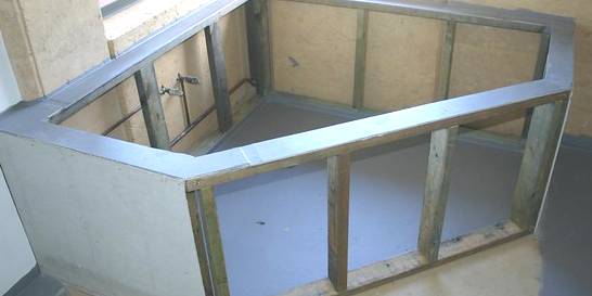 badwand laten plaatsen